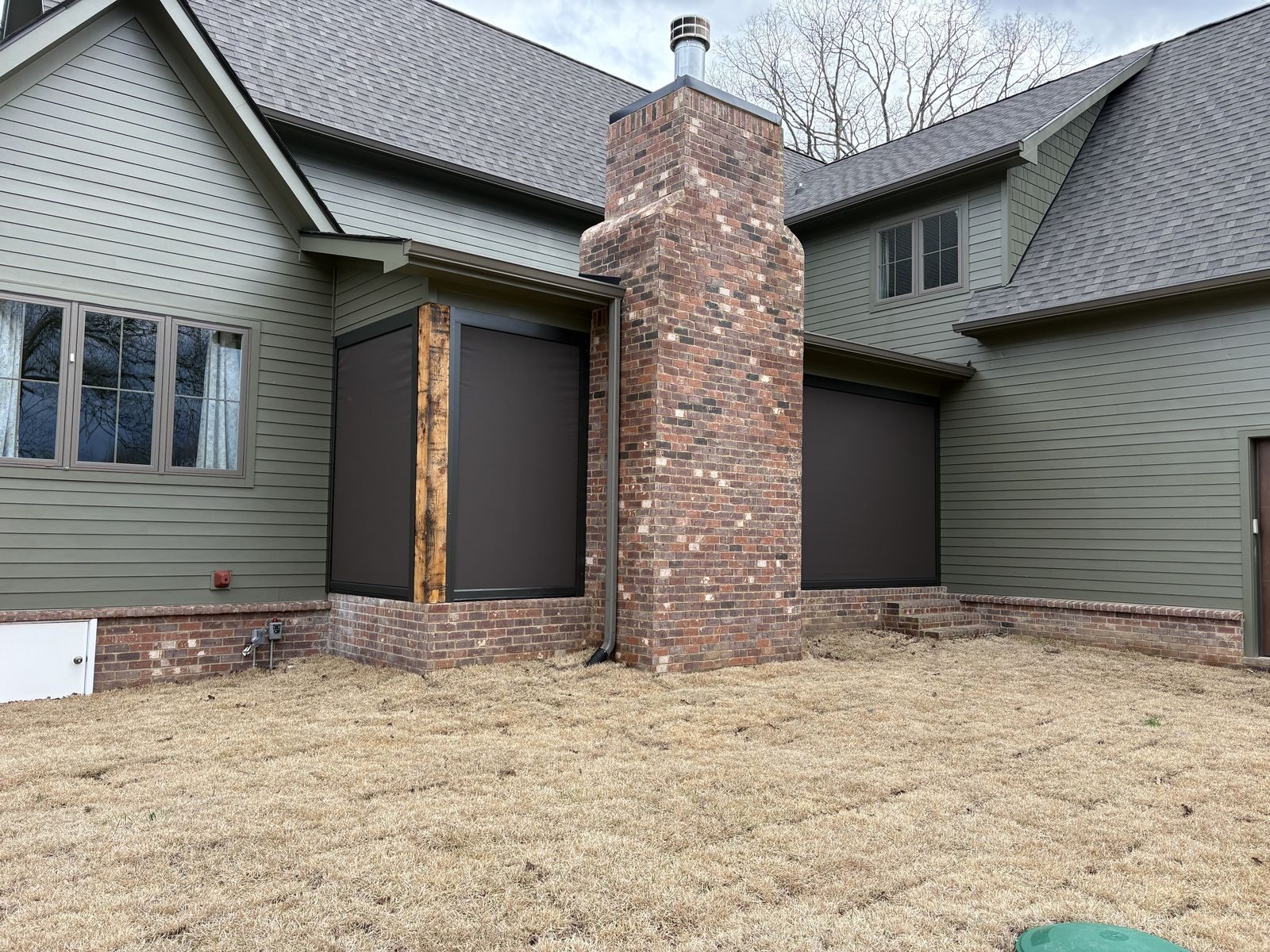 Motorized screens on brick home